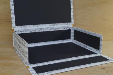 Box for notebooks with music motif