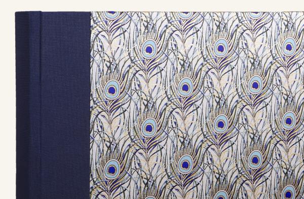 Exquisite folder with gilded peacock feather motif