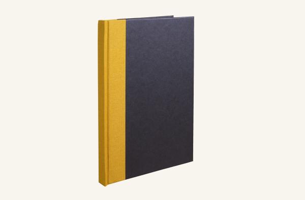 Black notebook, mustard linen spine