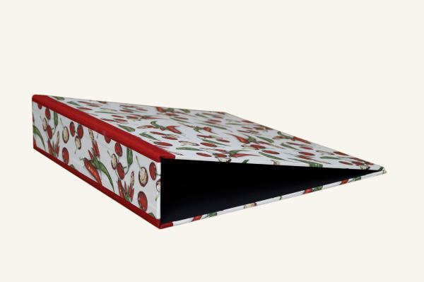 red and green hot pepper illustration on handmade folder with red linen edges